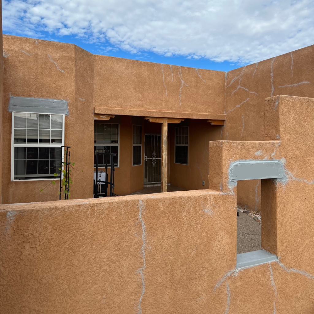 Stucco repair on exterior of a house in Albuquerque NM. Before paint is applied.