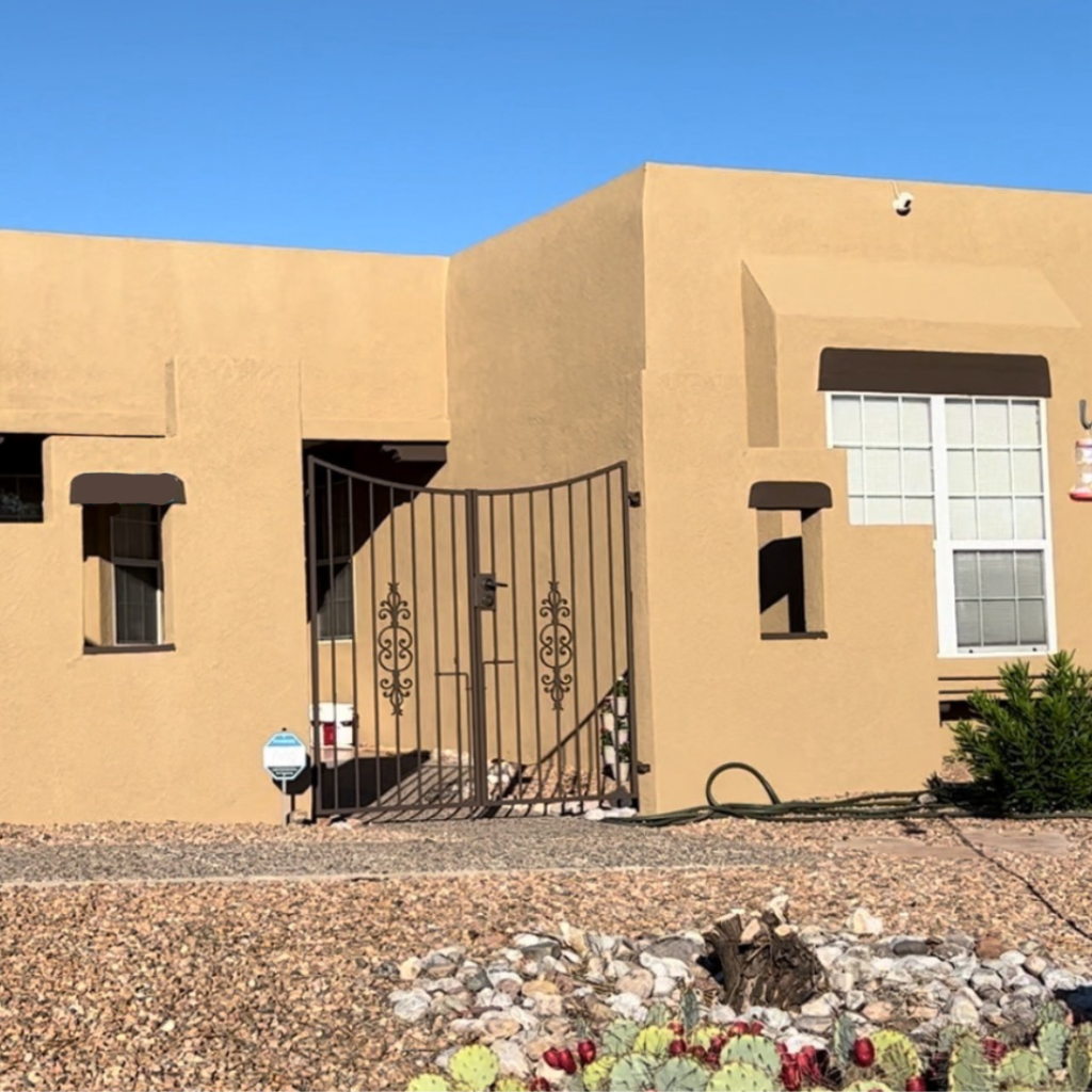 Photo of a completed exterior paint job done by Next Level Paint And Repair. The house is located in Rio Rancho.